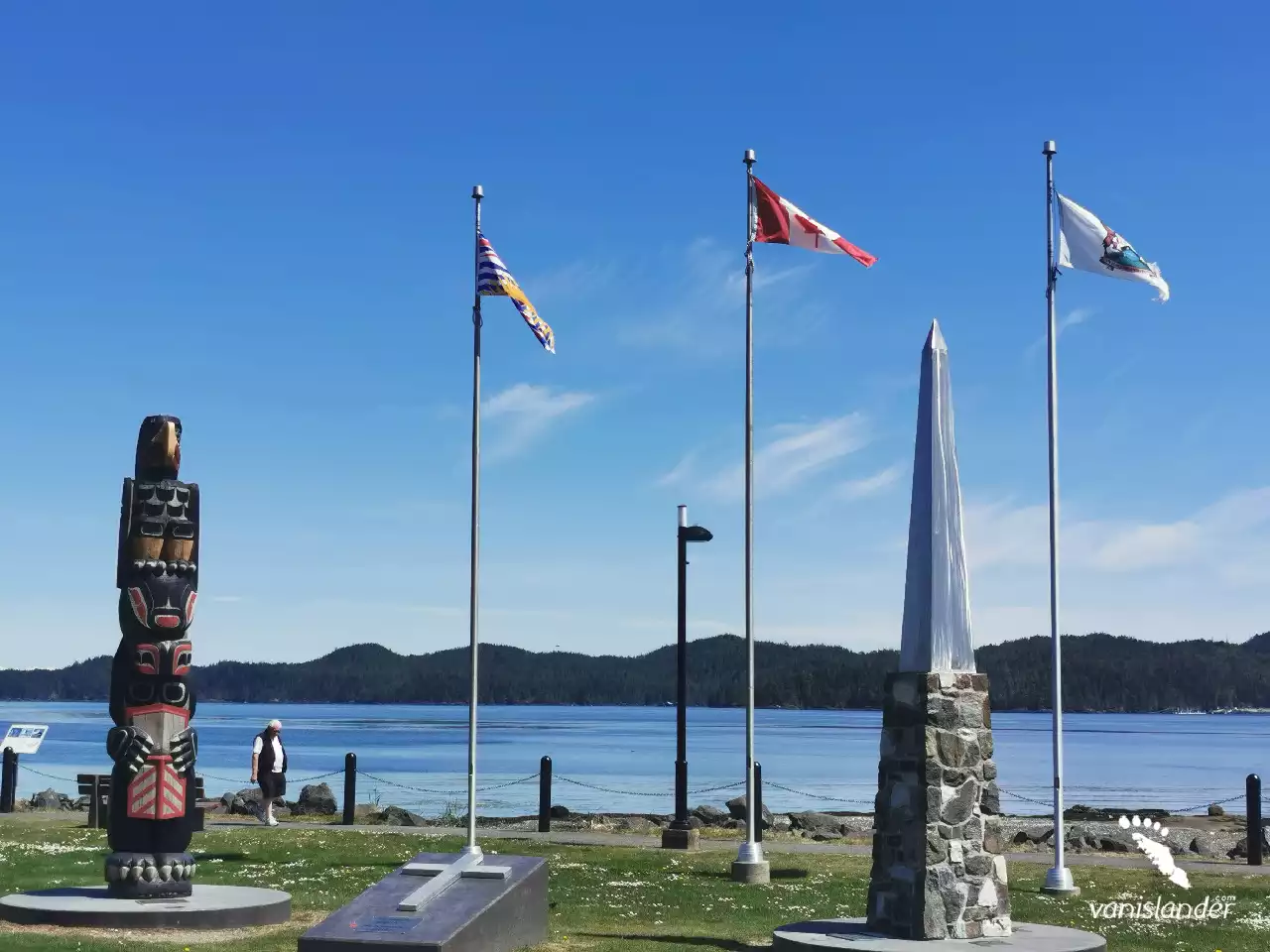 Totem, cenotaph and B.C. flag view in Port Hardy, Vancouver Island